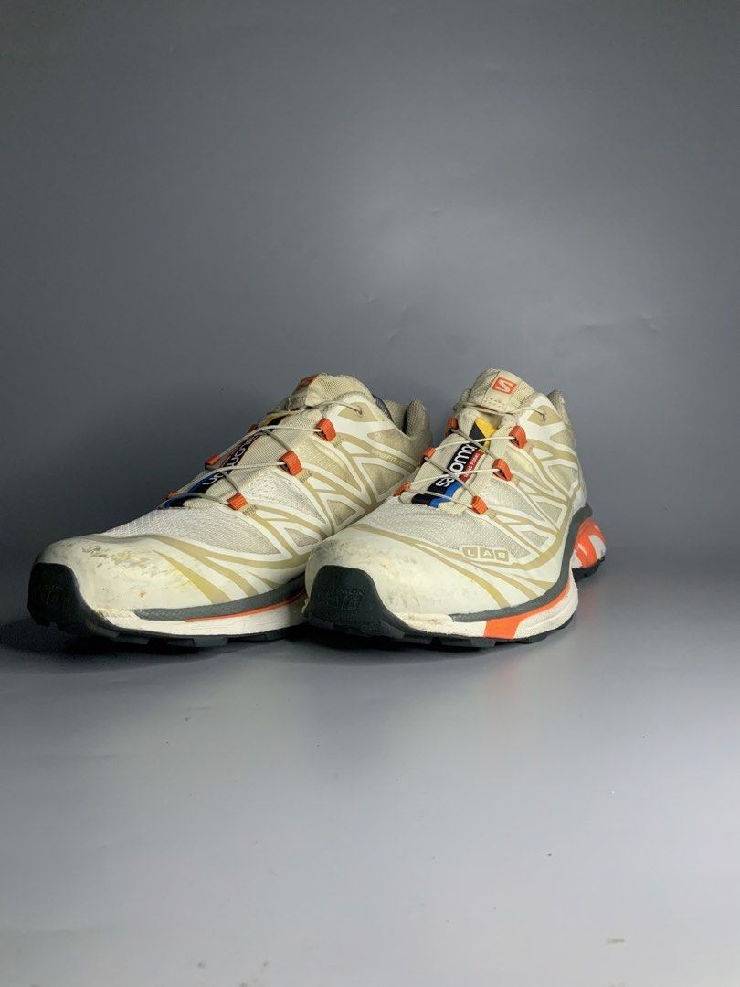 Salomon XT-6 (Category: Sneakers) located in Cavite. Submitted by kalye_footwear (Listing ID 1465713571, Image 3). Description: - Brand: SalomonXT-6 - Model: S-Lab XT-6 Soft Ground - Size: Us 10.5 , Euro 44.5 , Cm 28.5 - Colorway: White and off-white upper with vibrant orange, grey, blue, and yellow accents - Features: Quicklace system and S-Lab XT-6 heel branding - Condition: Excellent Lugs condition, minor scuffs and marks on the toe caps .