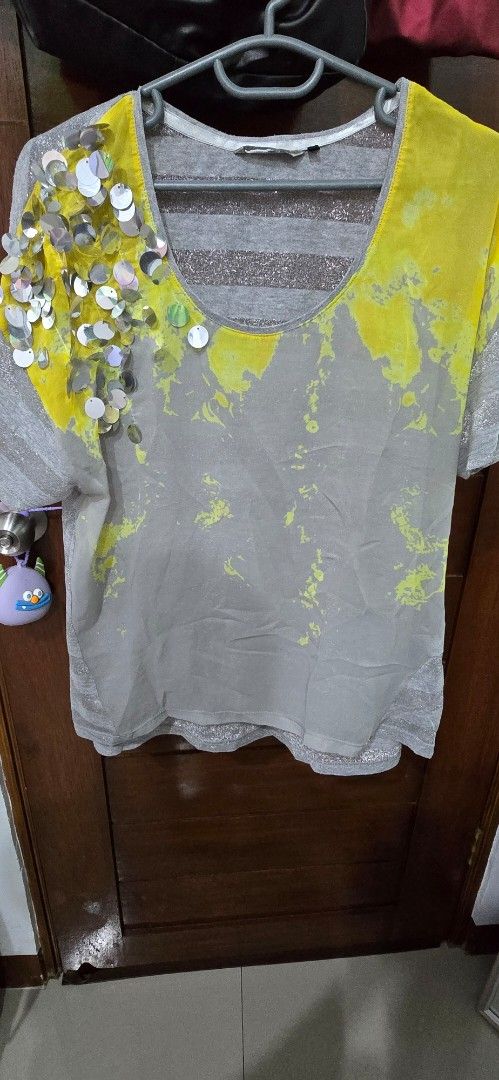 Salsa grey top with yellow paint splatter and sequins (Category: Shirts) located in Davao. Submitted by themercedez (Listing ID 1465659228, Image 1). Description: - Brand: Salsa - Color/Design: Grey with sparkly silver stripes and trendy yellow paint splatter - Details: Eye-catching cluster of shiny round sequins near the neckline - Fit & Style: Short sleeves, round collar, soft and comfortable fabric - Condition: Excellent pre-loved or brand new