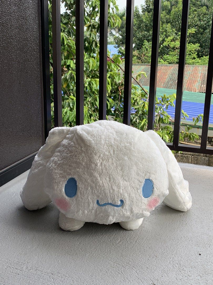 Sanrio Cinnamoroll lying down plush (Category: Plushies & Soft Toys) located in Angeles City. Submitted by pablokids (Listing ID 1465642669, Image 3). Description: - Item: Large Cinnamoroll Plush Toy - Condition: Clean, well-maintained, deadstock - Material: Super soft, all-over fluffy fabric (shiny!) - Design: Floppy ears, blue embroidered eyes/mouth, pink blush, and curly tail in a cute lying down posture - Perfect for: Cuddle companion or room