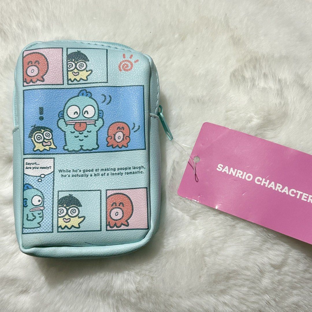 Sanrio Hangyodon Pouch (Category: Purses & Pouches) located in Quezon City. Submitted by kitsune.treasures (Listing ID 1465660810, Image 2). Description: *First to pay policy! *1 day reservation only. Failure to pay on time, auto cancel. 📍Quezon City * MOD: J&T | Lalamove * MOP: GCASH | BPI 📦ON HAND AND READY TO SHIP! CONDITION: WHAT YOU SEE IS WHAT YOU GET. Dimensions: Kindly check the photos for the actual measurements. Please check all the p