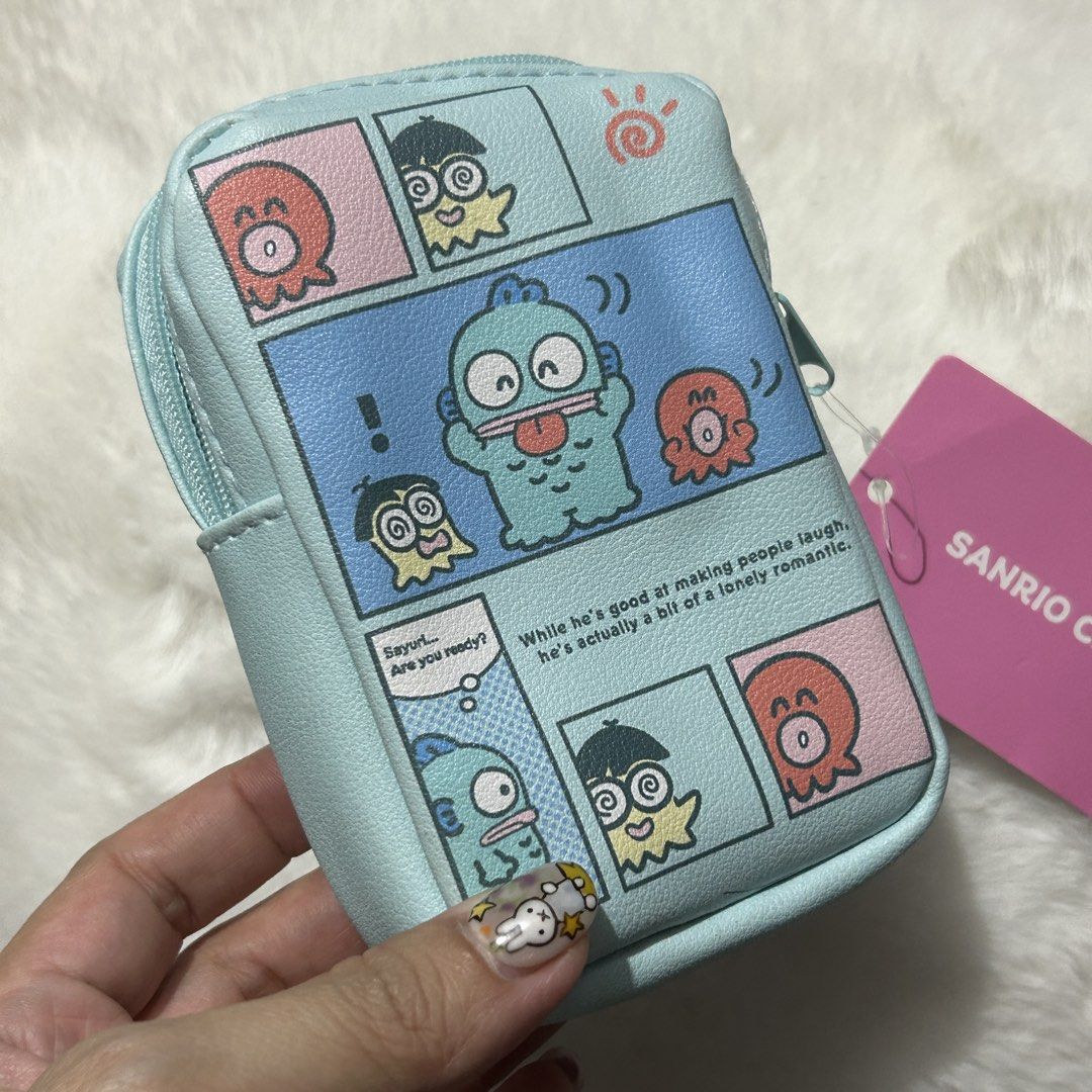 Sanrio Hangyodon Pouch (Category: Purses & Pouches) located in Quezon City. Submitted by kitsune.treasures (Listing ID 1465660810, Image 1). Description: *First to pay policy! *1 day reservation only. Failure to pay on time, auto cancel. 📍Quezon City * MOD: J&T | Lalamove * MOP: GCASH | BPI 📦ON HAND AND READY TO SHIP! CONDITION: WHAT YOU SEE IS WHAT YOU GET. Dimensions: Kindly check the photos for the actual measurements. Please check all the p