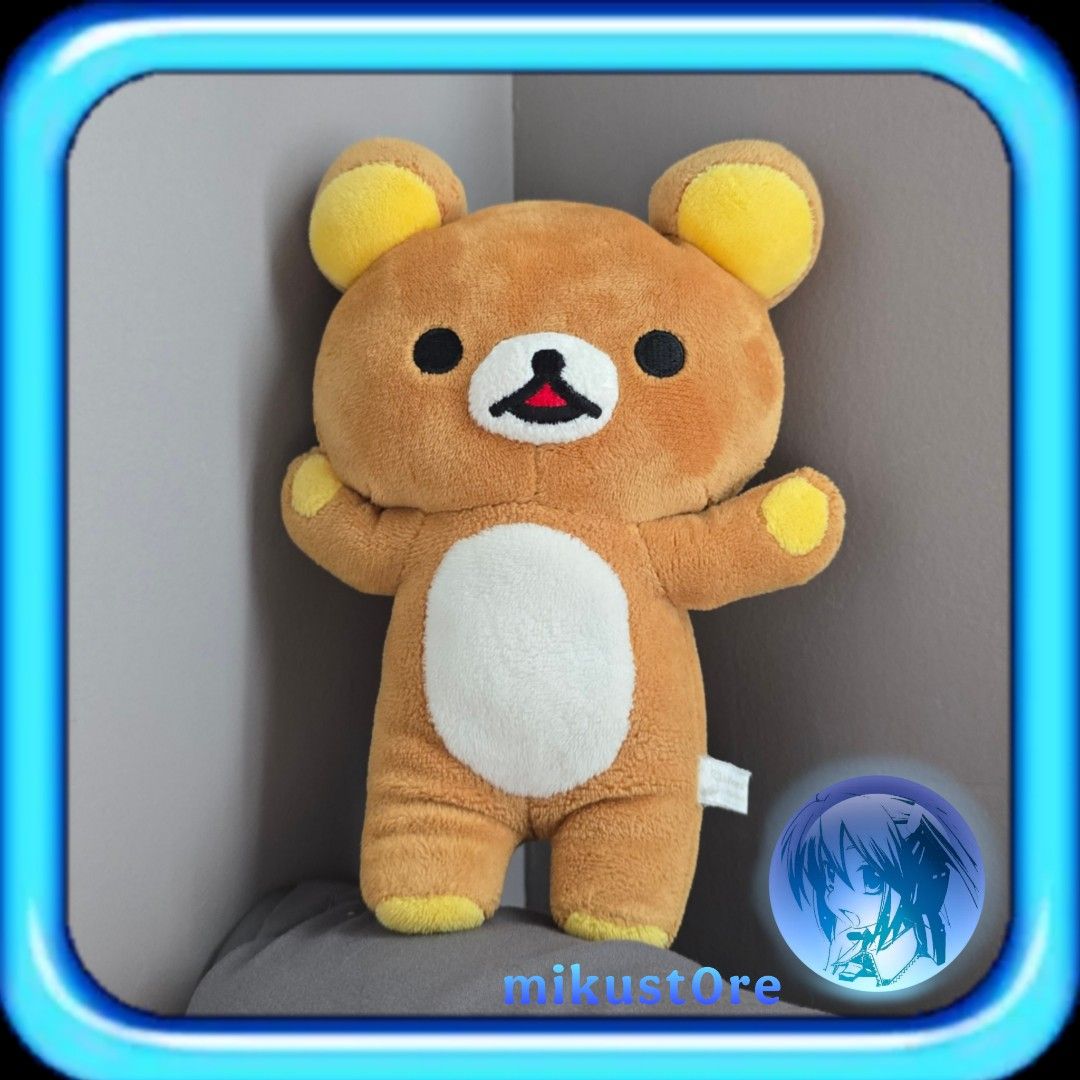 San-X Rilakkuma Plush Toy Brown Bear (Category: Plushies & Soft Toys) located in Manila. Submitted by mikust0re (Listing ID 1465712911, Image 1). Description: - Authentic Rilakkuma plush toy - Classic brown and white design with a white belly patch - Adorable embroidered facial features - Yellow accent details on ears, paws, and feet - Made with ultra-soft, huggable fabric - Side tag still attached - Standard sitting/standing size.