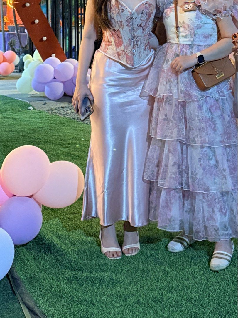 Satin Maxi Skirt - Pink (Category: Skirts) located in Makati City. Submitted by warm.abc123 (Listing ID 1459583522, Image 2). Description: - Flowy satin maxi skirt - Pretty pink shade - High-waisted design - Skims the body and flares slightly at the hem - Versatile: perfect for events or everyday chic.
