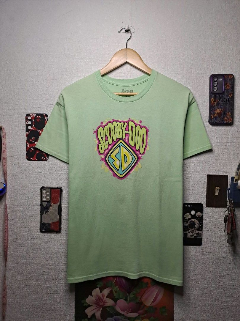 Scooby - Doo "Scooby Doo Snacks" Light Green Unisex (Category: Tshirts & Polo Shirts ) located in Manila. Submitted by yaseen__73 (Listing ID 1465752441, Image 2). Description: Scooby - Doo Graphics Scooby Snacks Hard Print With Back Hit Light Green Tagless Retro Modern Released by Mad Engine Global. LLC Wearing Size : Medium on Tag Dimensions : See Photo Color Rate : 9.9/10 No Issue Nearly New Condition Pre - OWNED or Best Offer Courier : J&T La