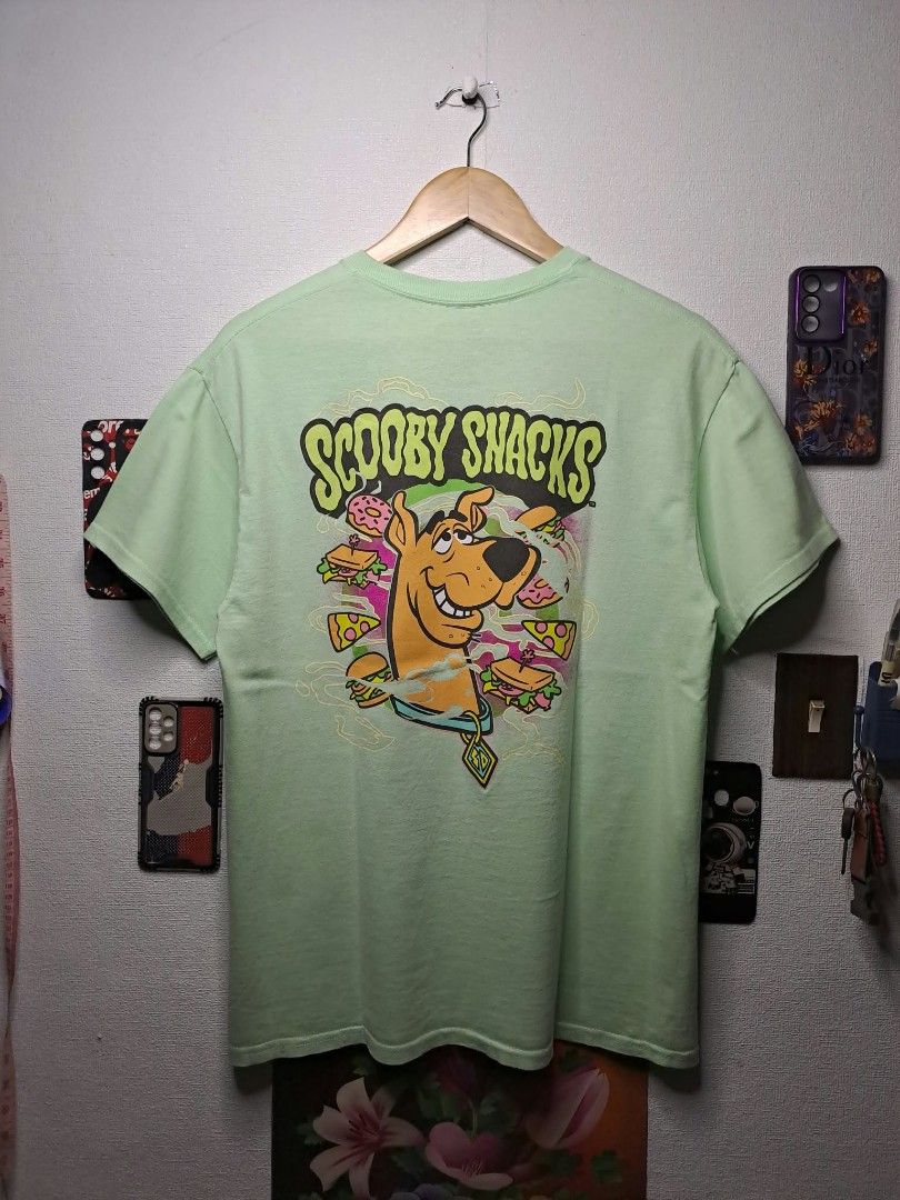 Scooby - Doo "Scooby Doo Snacks" Light Green Unisex (Category: Tshirts & Polo Shirts ) located in Manila. Submitted by yaseen__73 (Listing ID 1465752441, Image 1). Description: Scooby - Doo Graphics Scooby Snacks Hard Print With Back Hit Light Green Tagless Retro Modern Released by Mad Engine Global. LLC Wearing Size : Medium on Tag Dimensions : See Photo Color Rate : 9.9/10 No Issue Nearly New Condition Pre - OWNED or Best Offer Courier : J&T La