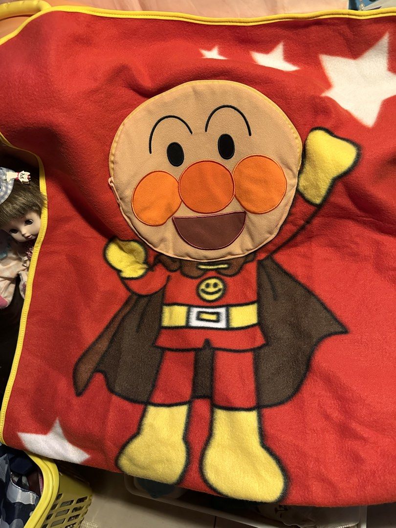 SEGA Anpanman Blanket / Pillow (Category: Bedding & Towels) located in Cainta. Submitted by mochimochiko (Listing ID 1465631562, Image 1). Description: - Official SEGA prize item imported from China - Features cute Anpanman character graphic, white stars, and yellow edge trim - Soft and lightweight red fleece fabric - Unique 2-in-1 design: folds up easily to store inside a built-in pocket shaped like Anpanman's face with a zipper closure - Great 
