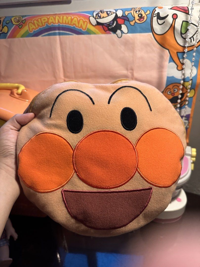 SEGA Anpanman Blanket / Pillow (Category: Bedding & Towels) located in Cainta. Submitted by mochimochiko (Listing ID 1465631562, Image 2). Description: - Official SEGA prize item imported from China - Features cute Anpanman character graphic, white stars, and yellow edge trim - Soft and lightweight red fleece fabric - Unique 2-in-1 design: folds up easily to store inside a built-in pocket shaped like Anpanman's face with a zipper closure - Great 