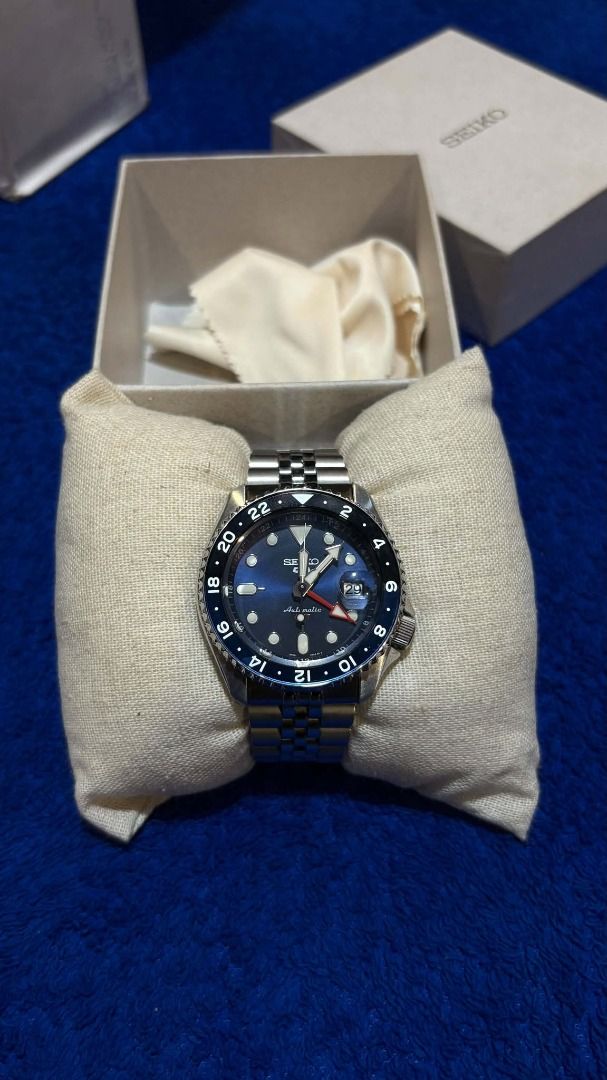 Seiko Automatic Watch (Category: Everything Else Others) located in Manila. Submitted by newwind.52e349 (Listing ID 1465669446, Image 1). Description: Seiko Automatic Watch Blue dial with luminous hour markers Stainless-steel bracelet Black/blue GMT-style rotating bezel Date display at 3 o’clock Automatic mechanical movement Classic sporty and elegant design Comes with presentation box and cushion Suitable for everyday and formal wear.
