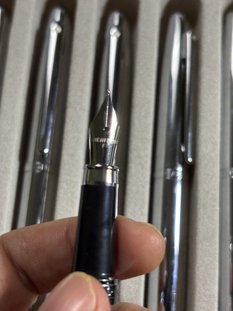 Sheaffer Fountain Pen Fine Nib (Category: Stationery & School Supplies) located in Manila. Submitted by vandconline.store2019 (Listing ID 1465756480, Image 2). Description: - Authentic Sheaffer matching fountain pen set - Sleek stainless steel barrels with secure clip caps - Fine metal nibs for smooth, precise writing - Convenient visible feed system on the underside - Beautifully organized in a grey presentation tray - Ideal for everyday use, jo