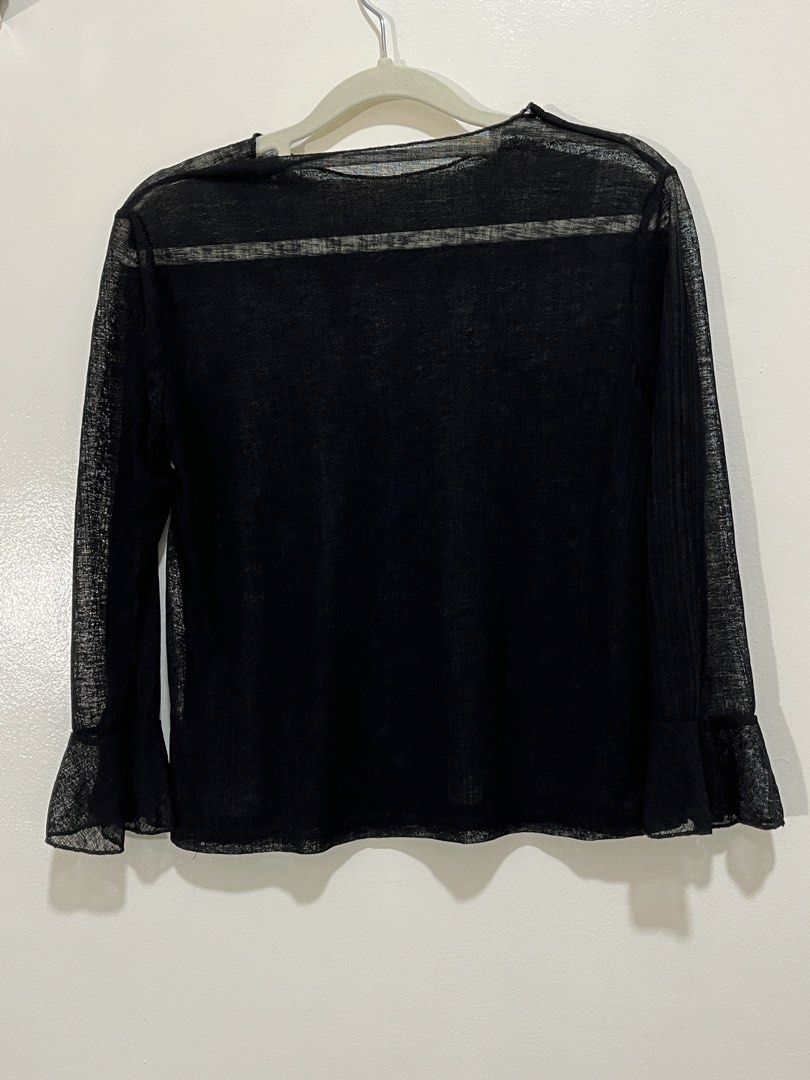 Sheer Lightweight Black Long-sleeve Top Flared Sleeves (Category: Longsleeves) located in Baguio. Submitted by nailongdeclutters (Listing ID 1465651892, Image 2). Description: ⭐Color: sheer black ⭐️Material: 95% Polyester 5% Spandex ⭐Small to medium.