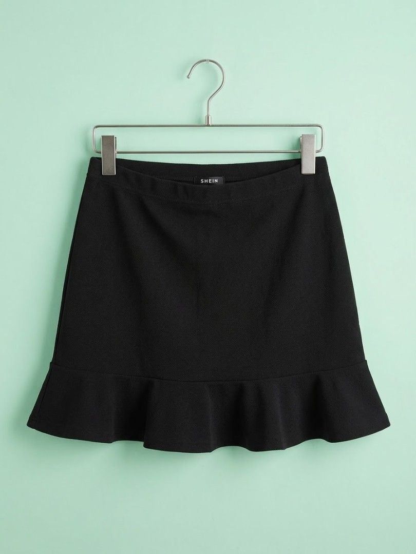 SHEIN Black Ruffle Hem Mini Skirt (Category: Skirts) located in Manila. Submitted by elvmoo (Listing ID 1465740180, Image 1). Description: worn twice, good as new. stretchable 📍nangka, marikina.