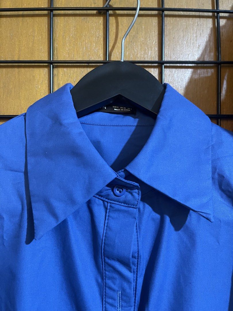SHEIN Blue Long Sleeve Button-Up Shirt Size S (Category: Longsleeves) located in Pasay City. Submitted by etcunlimited0 (Listing ID 1465689672, Image 2). Description: - Brand: SHEIN - Color: Bright Blue - Size: S (EU 36, US 4) - Design: Classic pointed collar, long sleeves, front button closure - Material: Standard lightweight shirt fabric - Condition: never use - declutter .