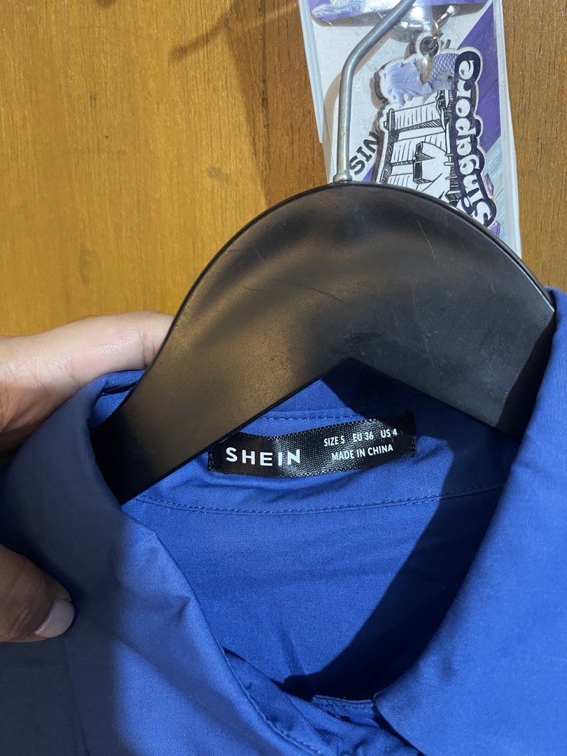 SHEIN Blue Long Sleeve Button-Up Shirt Size S (Category: Longsleeves) located in Pasay City. Submitted by etcunlimited0 (Listing ID 1465689672, Image 3). Description: - Brand: SHEIN - Color: Bright Blue - Size: S (EU 36, US 4) - Design: Classic pointed collar, long sleeves, front button closure - Material: Standard lightweight shirt fabric - Condition: never use - declutter .