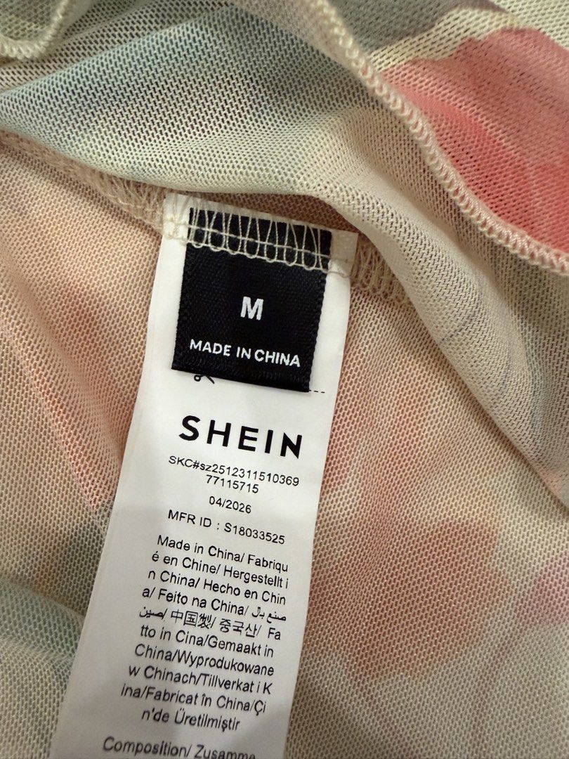 SHEIN Floral Print Halter Mesh Top (Category: Sleeveless) located in Calamba. Submitted by miss.ksnap (Listing ID 1465646408, Image 3). Description: - Brand: SHEIN - Style: Halter top with asymmetrical hem - Pattern: Colorful all-over floral print - Material: Sheer mesh (super lightweight and flowy) - Size: M - Condition: Worn once for a quick photo, practically brand new - Features: Ties securely behind the neck.
