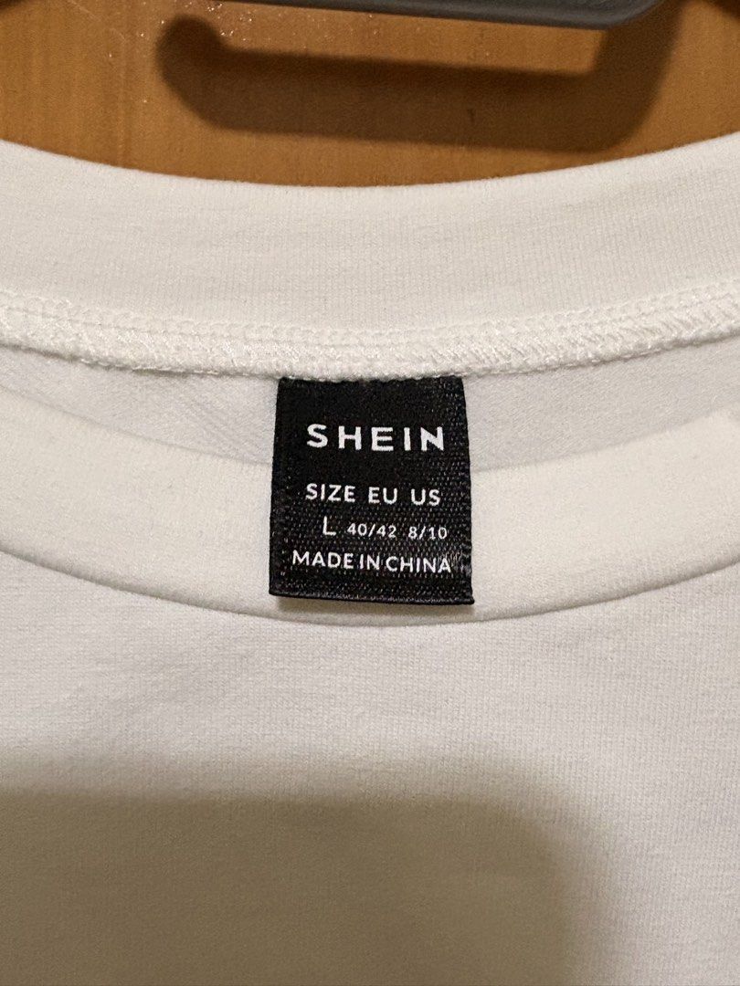 Shein White and Blue Denim Patchwork T-Shirt Size L (Category: Shirts) located in Mandaue City. Submitted by klosetfindscebu (Listing ID 1465667638, Image 3). Description: - Brand: Shein - Size: L (fits EU 40/42, US 8/10) - Design: Fun colorblock crew neck tee with white and blue denim contrast front panel - Detail: Chic asymmetric ruched side - Material: 79% cotton, 17% polyester, 4% elastane (soft with a bit of stretch) - Care: Machine washable
