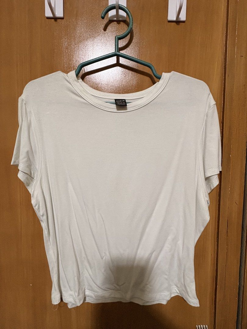 SHEIN White T-Shirt Size L (Category: Shirts) located in Mandaue City. Submitted by klosetfindscebu (Listing ID 1465660928, Image 1). Description: - Brand: SHEIN - Size: L - Color: Solid White - Fit: Relaxed fit with a classic round neckline - Material: Soft and comfortable fabric - Style: Casual everyday wear, easy to pair with jeans or skirts - Condition: Clean and well-maintained wardrobe staple.