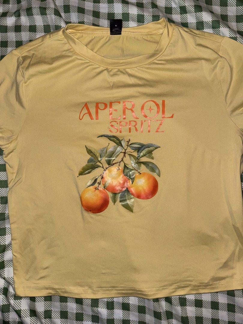 SHEIN Yellow Aperol Spritz Shirt (Category: Blouses) located in Quezon City. Submitted by mkl.p (Listing ID 1465706333, Image 2). Description: - M on tag - no flaws - good as new; used once lang - semi crop - pm for when worn loc timog qc.