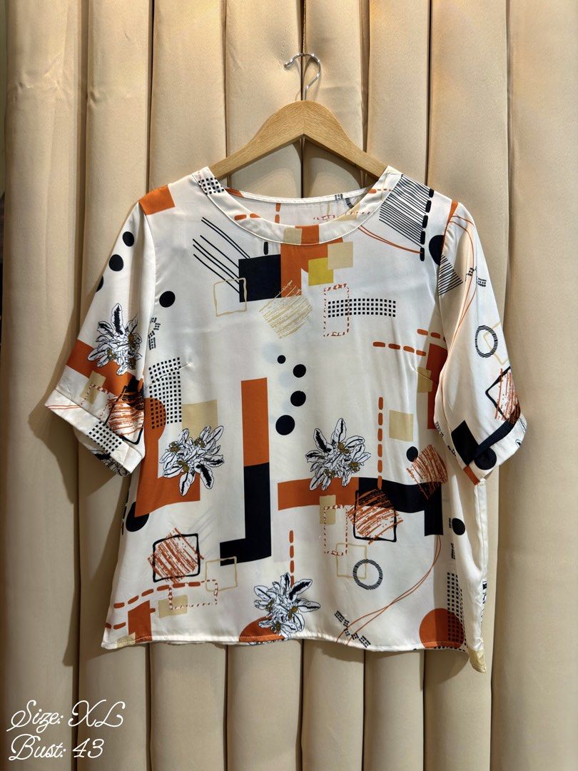Short-Sleeved Blouse (Category: Blouses) located in Manila. Submitted by glamstylemnl (Listing ID 1465634676, Image 1). Description: ♡ SIZE: XL ♡ BUST: 43 ♡ Swipe left to see the actual color & details ♡ abstract geometric floral print / satin silk like ♡ HQ • 10/10 ♡ Ready to wear 👚.