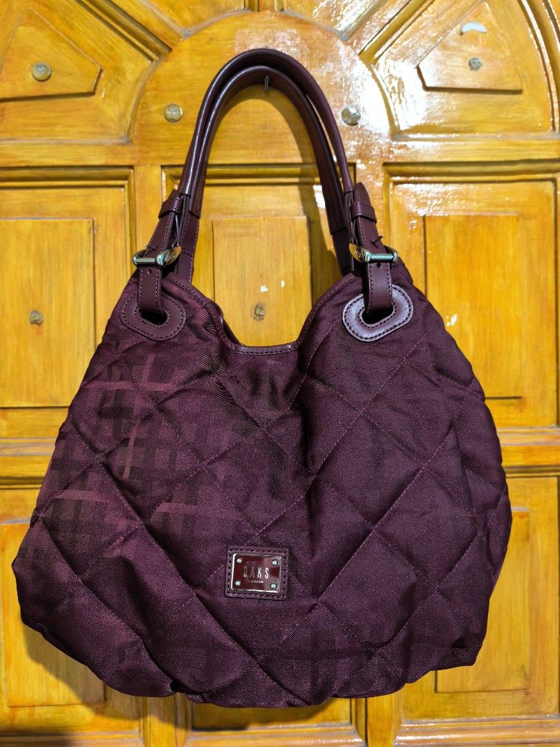 Shoulder bag (Category: Shoulder Bags) located in Manila. Submitted by khulet2008 (Listing ID 1465668194, Image 1). Description: D-a-K-s nylon hobo bag Super cute in actual. Maroon color. Lightweight. Soft. Personal fave. 😍.