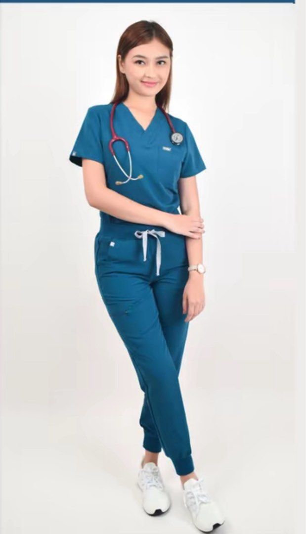 SIGNA Caribbean Scrubsuit (Category: Sets or Coordinates) located in Makati City. Submitted by sohdeclutters_ (Listing ID 1465712458, Image 1). Description: - Brand: SIGNA - Item: Medical scrub set (V-neck top & jogger pants) - Color: Caribbean blue - Size: Small - Details: Top features a front pocket and brand patch; pants have an elastic drawstring waist - Material: Figs like fabric.