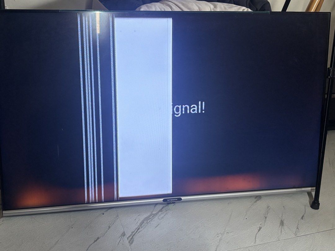 Skyworth TV with screen display issue 43 in (Category: TV) located in Caloocan City. Submitted by sahhahaha (Listing ID 1465622348, Image 1). Description: - Brand: Skyworth TV with silver bottom bezel and centered logo - Condition: Selling AS IS for repair or spare parts only - Issues: Screen shows vertical white lines, a large white vertical block on the left, and slight bottom corner light bleed/discoloration - Ideal for technicians, hobbyists,