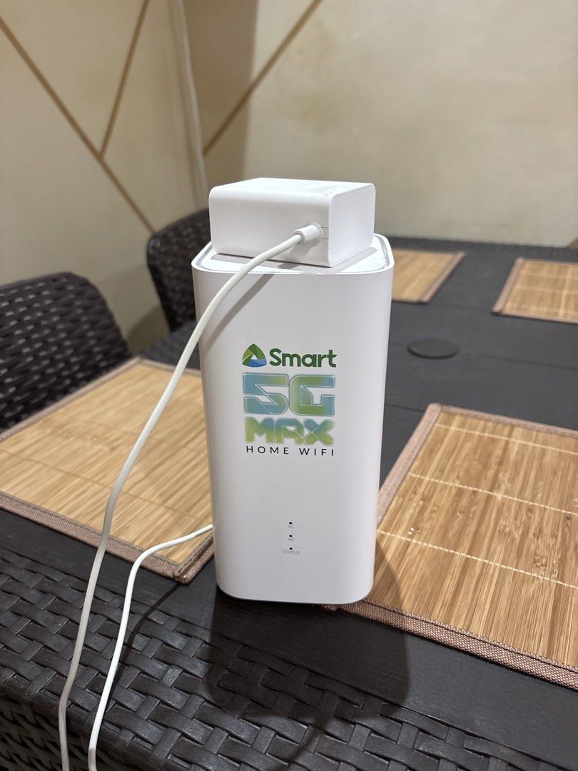 Smart 5G Max Home Wifi (Category: Networking) located in Mandaluyong City. Submitted by forzabiz.solutions (Listing ID 1465757169, Image 1). Description: - Smart 5G Max Home Wifi modem in sleek white - Includes main unit and original power brick with cable - Front indicator lights for easy status, 4G, and 5G monitoring - Clean outer casing with standard branding - Fast and reliable home internet solution.