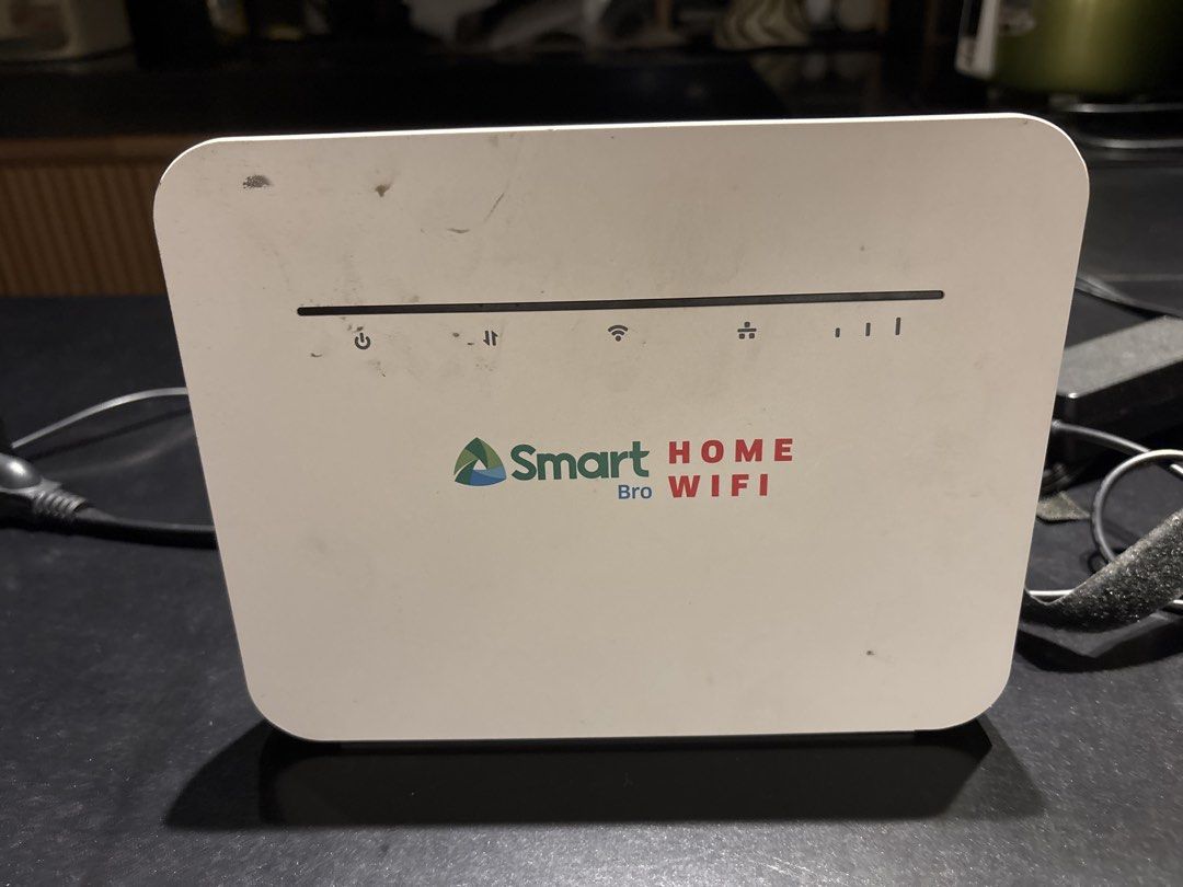 Smart Bro Home WiFi Router (Category: Networking) located in Mandaluyong City. Submitted by forzabiz.solutions (Listing ID 1465754913, Image 1). Description: - Model: Smart Bro Home WiFi Modem Router (White) - Condition: Fully working, minor scuffs and dust marks from normal use - Features: Indicator lights for power, signal, and connection status - Inclusions: Power adapter cable included - Setup: Plug and play ready for instant home internet.