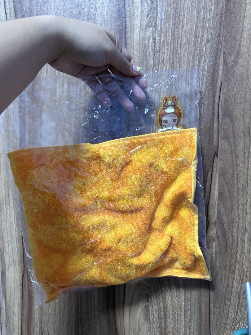 Sonny Angel Orange Hand Towel (Category: Towels, Napkins & Holders) located in Manila. Submitted by fritzha (Listing ID 1465716508, Image 2). Description: - Brand new and still sealed in original packaging - Vibrant citrus orange textured hand towel - Features a cute Sonny Angel character patch on the corner - Soft and absorbent material, ideal for hands or face - Fun pop-out design to brighten up any bathroom or kitchen.