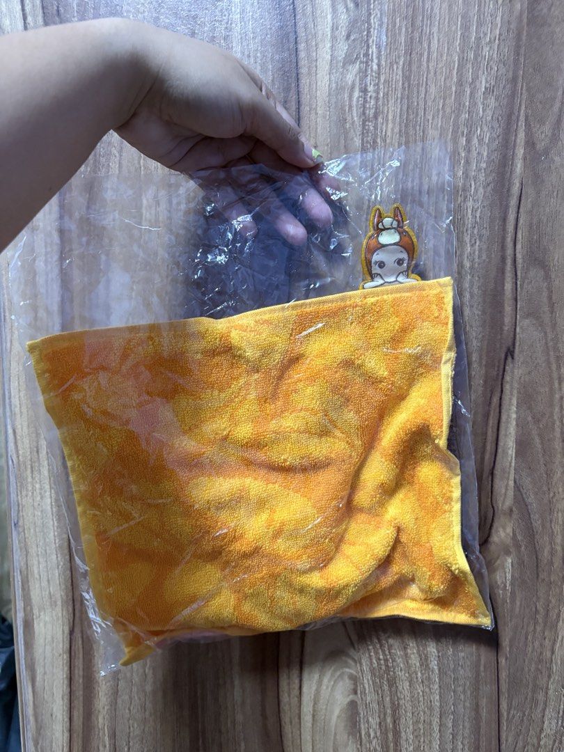 Sonny Angel Orange Hand Towel (Category: Towels, Napkins & Holders) located in Manila. Submitted by fritzha (Listing ID 1465716508, Image 1). Description: - Brand new and still sealed in original packaging - Vibrant citrus orange textured hand towel - Features a cute Sonny Angel character patch on the corner - Soft and absorbent material, ideal for hands or face - Fun pop-out design to brighten up any bathroom or kitchen.