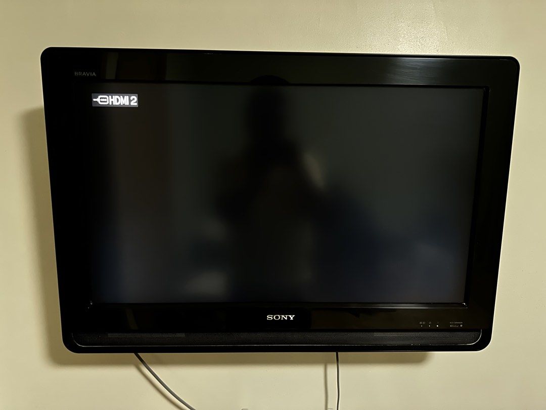 Sony Bravia KLV-32S400A LCD TV (Category: TV) located in Pasig City. Submitted by oshiekins (Listing ID 1465687985, Image 2). Description: - Brand: Sony Bravia LCD Television - Condition: Fully functional display unit - Design: Classic black bezel with integrated bottom speakers - Setup: Currently wall-mounted - Features: Powers on smoothly and displays menu with pre-loaded streaming apps via connected device - Perfect for upgrading your living r