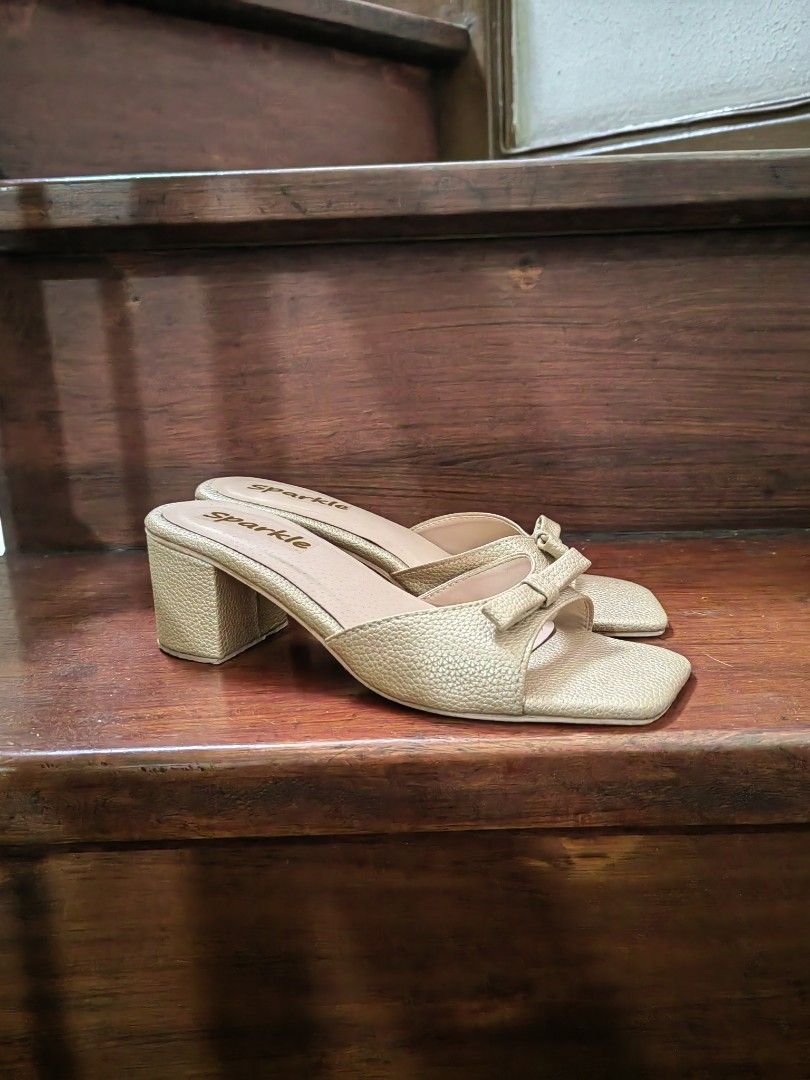 Matte Gold Shoes (Category: Heels) located in Manila. Submitted by mel.cruz (Listing ID 1465610197, Image 1). Description: - Color/Finish: Sparkle gold with a textured metallic exterior - Heel: Solid chunky block heel for easy, stable walking - Design: Square toe front with a cute bow detail on the strap - Style: Convenient slip-on design -Used only once at a wedding. I'm a sneakers and flats kind of a woman so this pair would just gather dust in