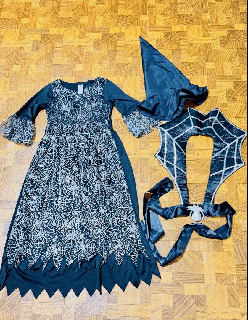 Spider Web Witch Costume from US (Category: Babies & Kids Fashion) located in Quezon City. Submitted by frappes (Listing ID 1465702583, Image 1). Description: - Brand: Tu - Size: 7-8 years (122-128 cm) - Material: 100% polyester - Set includes: Black dress with silver glitter spider web pattern, matching spider web collar piece, and pointy witch hat - Condition: Worn once for Halloween, excellent and clean shape.