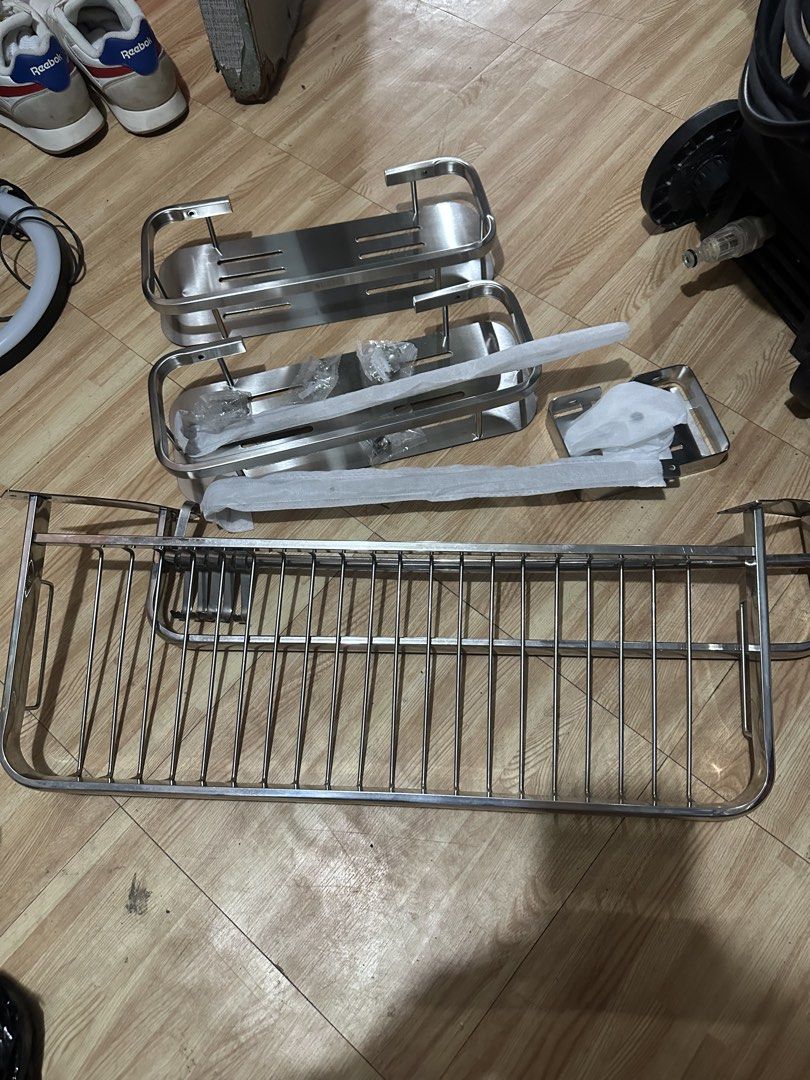 Stainless Steel Bathroom Storage Shelves Set (Category: Bathroom & Kitchen Fixtures) located in San Pedro. Submitted by claire7818 (Listing ID 1465633154, Image 1). Description: - Complete Set: Includes 2 solid rectangular shelves with drainage slots and 1 large wire basket. - Rust-Resistant & Durable: Made of high-quality stainless steel, perfect for wet areas like the shower or kitchen. - Multi-Purpose: Great for organizing shampoo, soap, bath 