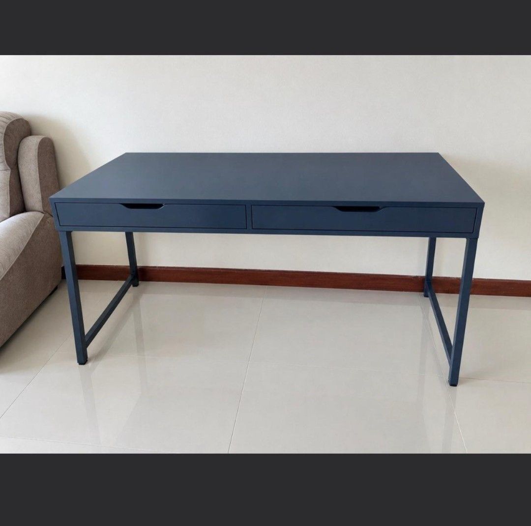 Study Table / Computer Table (Category: Tables & Sets) located in Singapore. Submitted by assshhhh (Listing ID 1465583010, Image 2). Description: study / computer table with minor scufs that u can see in picture. Wooden top metal legs. 2 drawers and wire hiding compartment at the back. Width: 60cm , Length: 131.6cm. Please arrange own transport or will charge extra. Able to nego slightly.