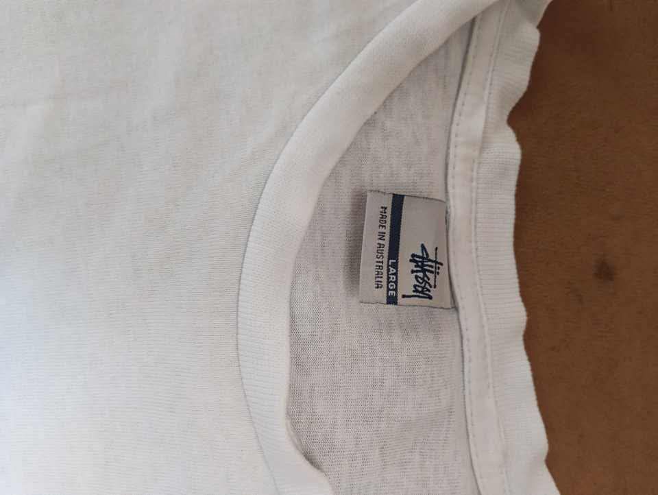Stussy @Australia (Category: Tshirts & Polo Shirts ) located in Manila. Submitted by archivethreads (Listing ID 1465582178, Image 3). Description: STUSSY @ AUSTRALIA T-SHIRT FOR SALE 🤍 📌 Condition: Pre-loved / Good condition 👕 Color: White ✨ Design: STUSSY @ Australia print 🧵 Material: Comfortable and lightweight 📏 Size: Please check the actual measurement upon inquiry Perfect for casual outfit, everyday wear, or streetwear look. Simple pero