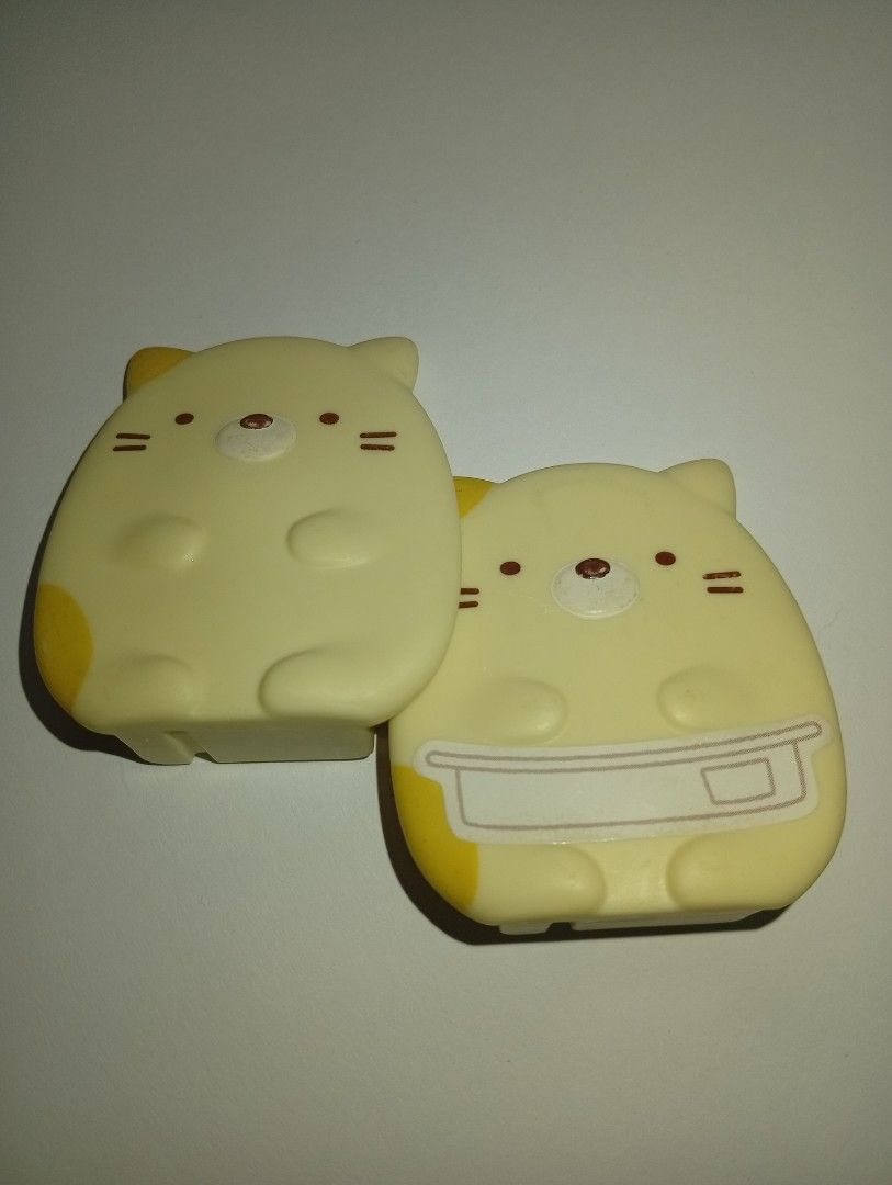 (San-X) 2 Sumikko Gurashi Retainer Case (Neko) (Category: Figurines & Statues) located in Tarlac. Submitted by kaizer_rabbit (Listing ID 1465680640, Image 3). Description: Sumikko Gurashi Retainer Case (Neko) Brand: San-X (Specifically produced as a specialized dental clinic novelty/exclusive distribution item in Japan, McDonald's 2025) with markings at the back of the Sumikko Origin: Designed in Japan 🇯🇵, made in China 🇨🇳 350php for these 2 