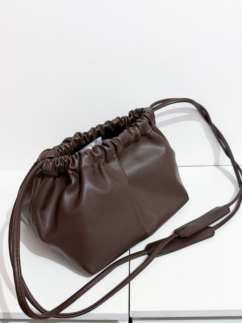 Sunnies Face Dumpling Bag Leather Drawstring Pouch in Cacao (Category: Shoulder Bags) located in Manila. Submitted by tryitoutfirst (Listing ID 1465741015, Image 3). Description: Bnew Sunnies Face Dumpling Bag in Cacao ₱450 .
