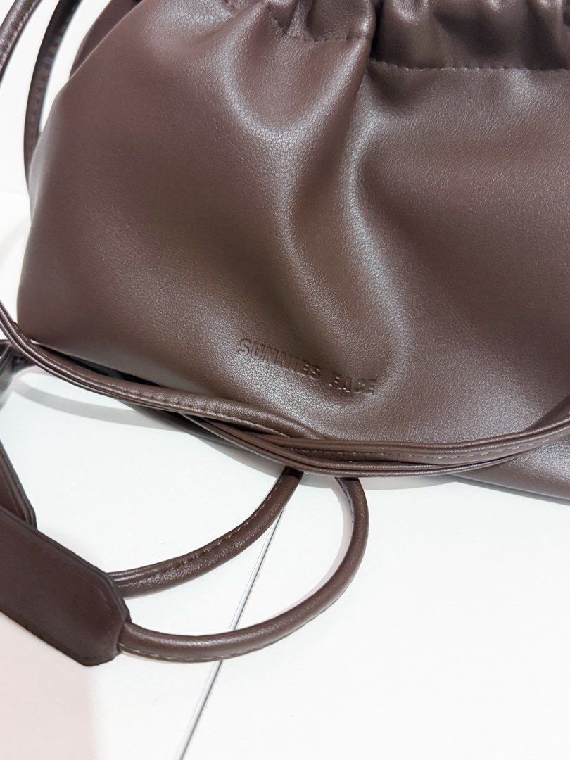 Sunnies Face Dumpling Bag Leather Drawstring Pouch in Cacao (Category: Shoulder Bags) located in Manila. Submitted by tryitoutfirst (Listing ID 1465741015, Image 2). Description: Bnew Sunnies Face Dumpling Bag in Cacao ₱450 .