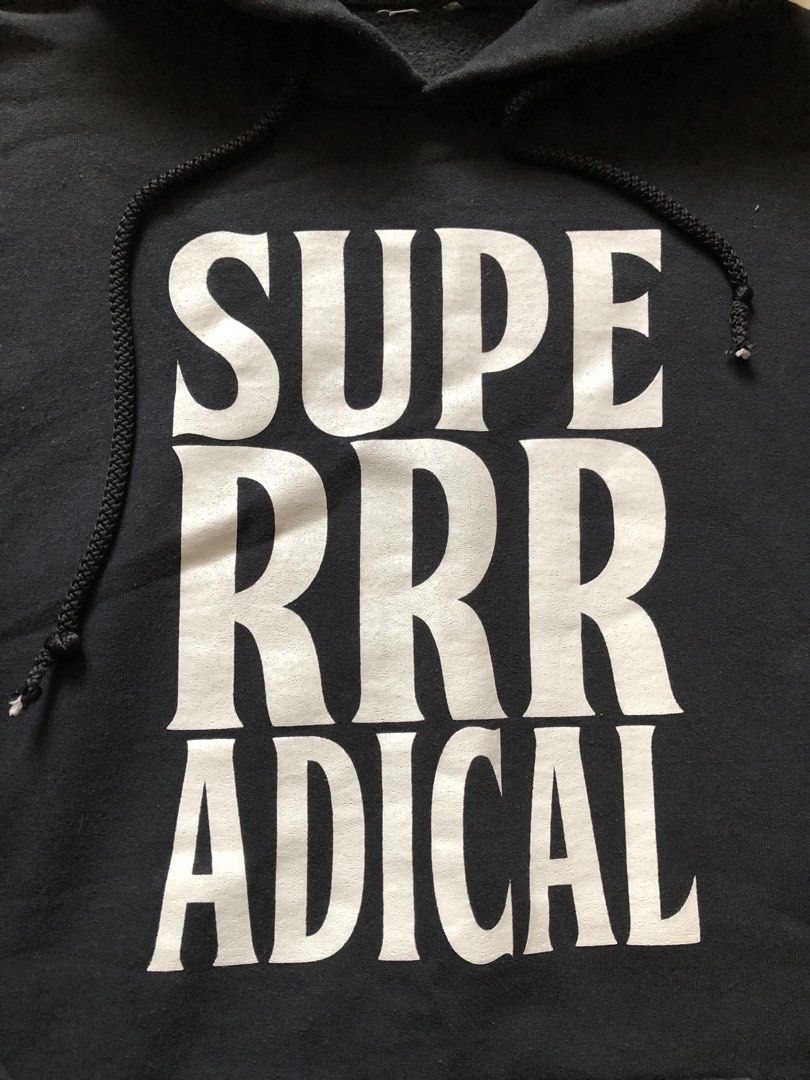 Super Radical Aim Here Hoodie (Category: Coats, Jackets and Outerwear) located in Agdangan. Submitted by theftpplug (Listing ID 1465580116, Image 2). Description: - Brand: Super Radical - Color: Black with big white text on the chest - Material: Thick cotton with cozy fleece lining inside - Details: Drawstrings with braided ends, graphic and handwriting print on the hood - Pocket: Front kangaroo pocket - Fit: Comfortable inner-printed size label 