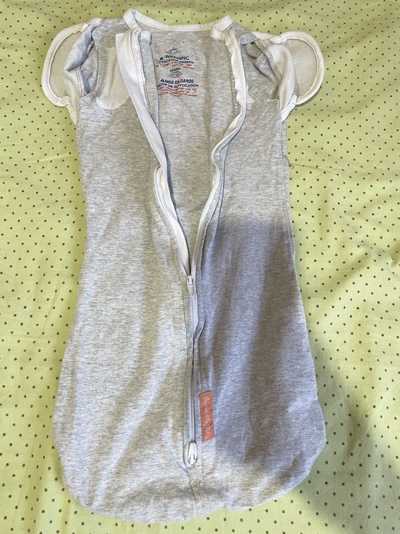 SwaddleMe Grey Swaddle Grand (Category: Cots & Cribs) located in San Jose del Monte. Submitted by momma_buys (Listing ID 1465598965, Image 3). Description: - Brand: SwaddleMe - Color/Pattern: Grey heather - Size: Grand (for growing infants) - Material: Soft cotton knit - Features: Dual zipper for easy midnight diaper changes - Versatility: Foldover arm openings (arms in or out) - Condition: Pre-loved, washed, and ready for use.