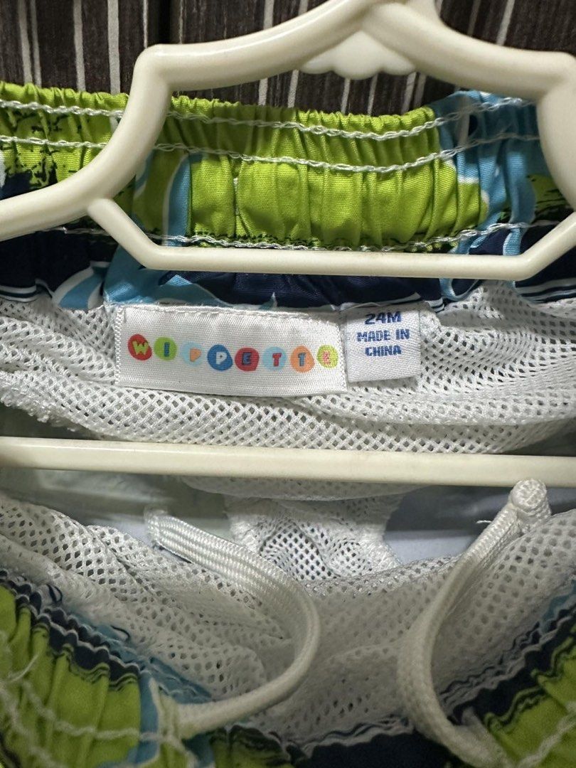 Swim Trunks for Toddlers (Category: Babies & Kids Fashion) located in Manila. Submitted by miladyrs (Listing ID 1465697299, Image 2). Description: - Brand/Style: Wippette Swim trunks - Design: Blue and Lime green shorts, with octopus print - Size: 24 Months - Features: Elastic waistband, white adjustable drawstring, and built-in white mesh lining - Great for beach days and pool trips.