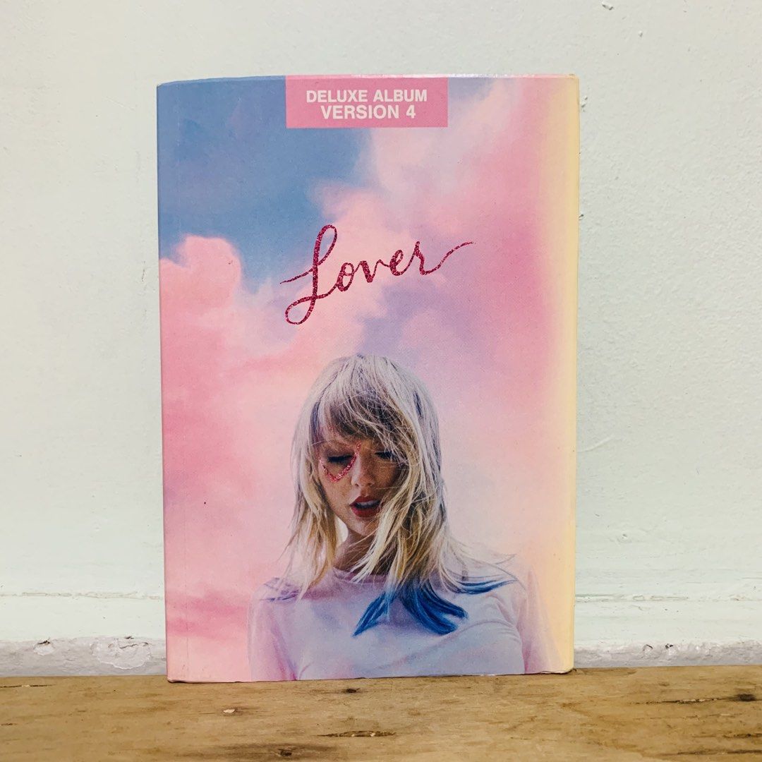 Taylor Swift Lover Deluxe Album Version 4 (Category: CDs & DVDs) located in Caloocan City. Submitted by offthegridfinds (Listing ID 1465756606, Image 1). Description: - Album: Taylor Swift Lover Deluxe Edition (Version 4) - Features: Standard tracklist + exclusive songwriting voice memos - Design: Colorful pastel cover art with Taylor wearing heart face paint - Format: Physical CD book package - Condition: Shows minor corner wear and creasing alo