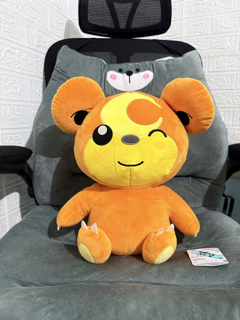 Teddiursa Pokémon Plush (Category: Plushies & Soft Toys) located in Cavite. Submitted by projectplushie (Listing ID 1465672880, Image 1). Description: - Official Teddiursa plush in vibrant orange - Adorable winking expression with crescent moon symbol on forehead - Clean fabric, smoke-free home, no stains or damage - Sits upright on its own easily - Official tag included - Perfect for Pokémon collectors and fans.