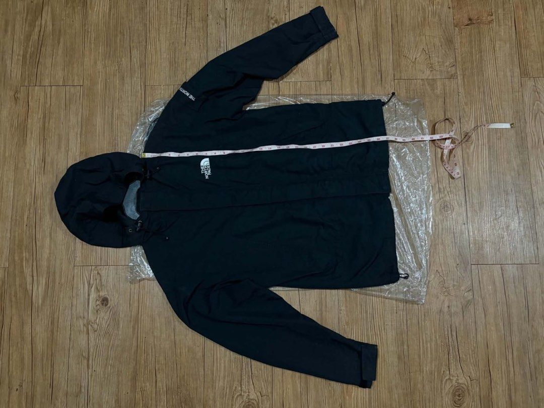 The North Face Black Hooded Jacket Size 85 (Category: Coats, Jackets and Outerwear) located in Mandaluyong City. Submitted by zaiampiloquio (Listing ID 1465608421, Image 1). Description: - Brand: The North Face - Color: Classic Black - Size: 85 (fits S/M) - Features: Full zip with wind flap, adjustable hood and hem drawstrings - Pockets: Two secure zippered hand pockets - Details: Embroidered logo on chest and sleeve - Condition: Clean and well-m