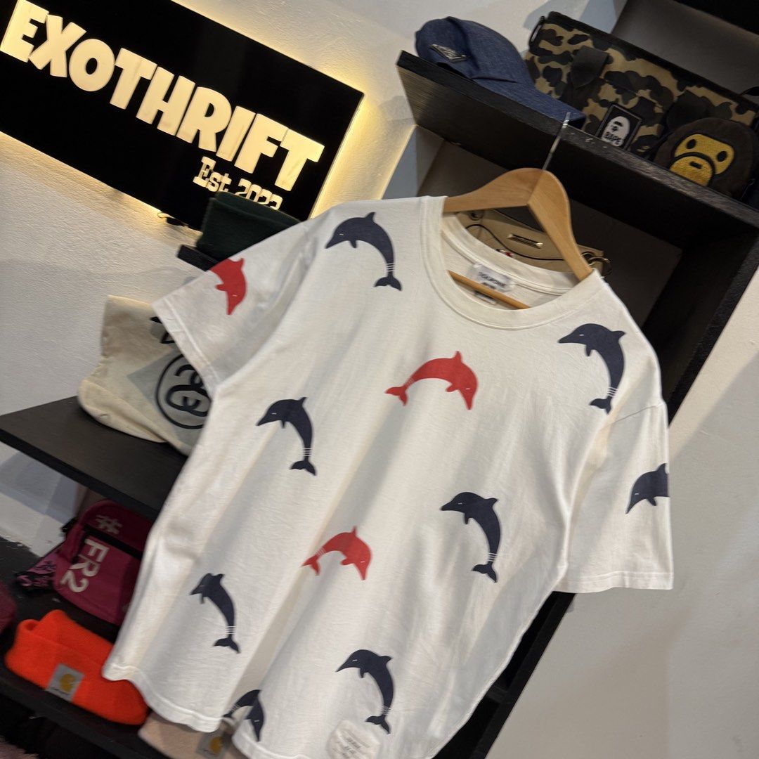 Thom Browne Dolphin Print Tee Size 3 (Category: Shirts) located in Manila. Submitted by carbungcoalex (Listing ID 1465755811, Image 2). Description: THOM BROWNE DOLPHIN SHIRT 21 by 27.5 Good Condition Complete tags 1300 CLAIM.