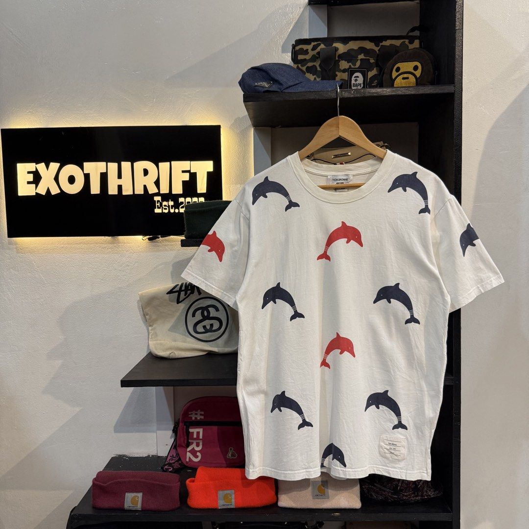 Thom Browne Dolphin Print Tee Size 3 (Category: Shirts) located in Manila. Submitted by carbungcoalex (Listing ID 1465755811, Image 1). Description: THOM BROWNE DOLPHIN SHIRT 21 by 27.5 Good Condition Complete tags 1300 CLAIM.
