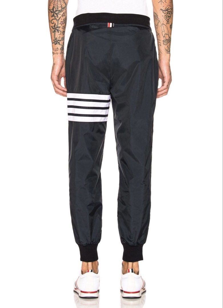 THOM BROWNE Light Weight Sweatpants (Category: Joggers) located in Manila. Submitted by walter_wt (Listing ID 1465663216, Image 3). Description: THOM BROWNE 4 bar Light Weight Nylon Sweatpants Tagged Size- 3 Dimension- Waistline: 34-36 Length: 38 -Made in Italy -Drawstring elastic waist -Zip fly and button closure -Mesh lined -Side zip pockets Self: 100% nylon -Lining: 100% polyamide -Trim: 95% cotton, 5% elastane -Rib knit trim -No issue .