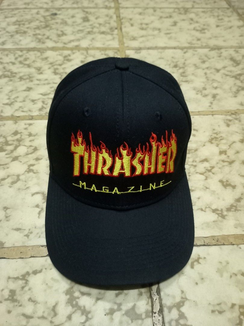Thrasher Magazine Flame Logo Black Cap Snapback (Category: Caps & Hats) located in Aguinaldo. Submitted by ukayandthrift (Listing ID 1465615769, Image 2). Description: - Color: Classic black - Design: Iconic embroidered Thrasher flame logo on the front - Authenticity: Features official MLB Genuine Merchandise taping and interior tag - Fit: Fully adjustable strap in the back for a custom fit - Quality: Clean fabric with solid stitching throughout 