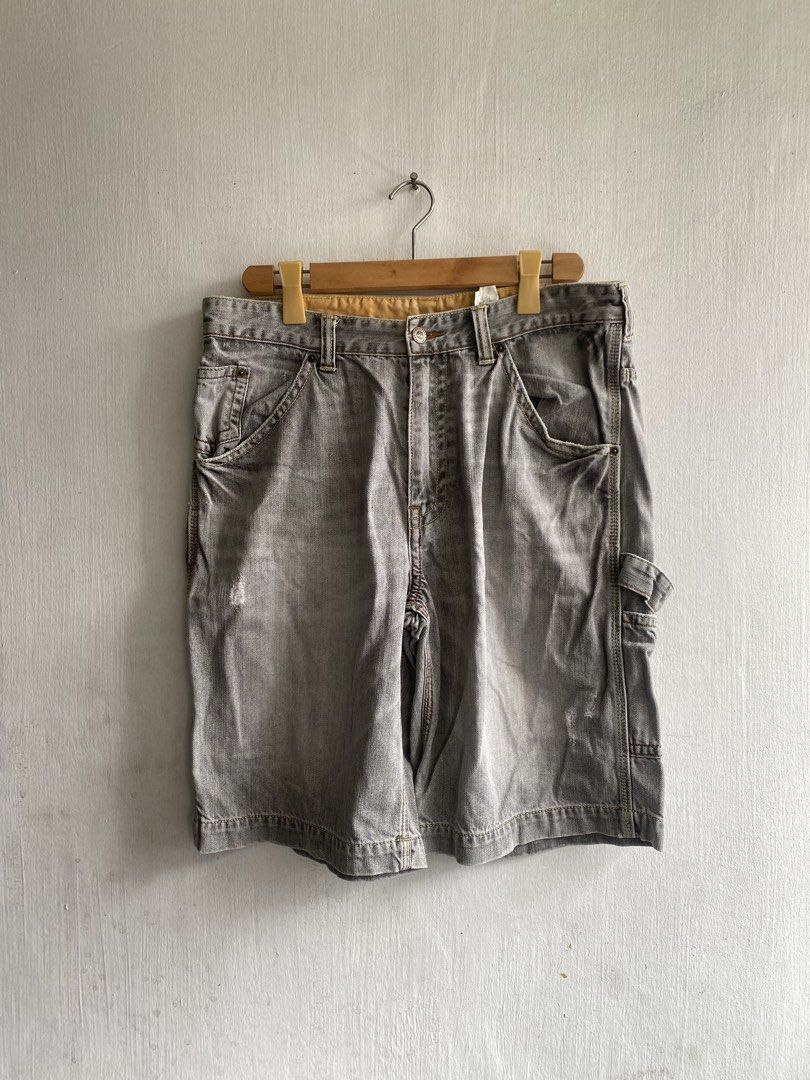 Timberland Grey Denim Cargo Shorts Size 34 (Category: Shorts) located in Manila. Submitted by anthony1723 (Listing ID 1465614735, Image 2). Description: - Brand: Timberland - Item: Denim cargo shorts - Color: Washed grey (vintage, worn-in look) - Size: 34 waist - Material: Heavy-duty cotton - Details: Deep side pockets, back pockets, hammer loop, branded buttons, yellow interior waistband lining, and back leather patch.