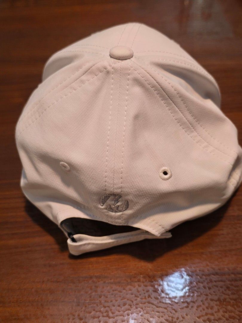 Titleist White Golf Cap with Orange Raised Logo (Category: Golf) located in San Juan City. Submitted by YardSaleSanJuan (Listing ID 1465655614, Image 2). Description: with magnet on visor - compatible with all metal ball markers - Brand: Titleist - Color: Clean white with bright orange raised front lettering - Style: Classic curved brim with stitched ventilation eyelets - Fit: Adjustable back strap for a custom fit - Perfect for golf, sports, or 